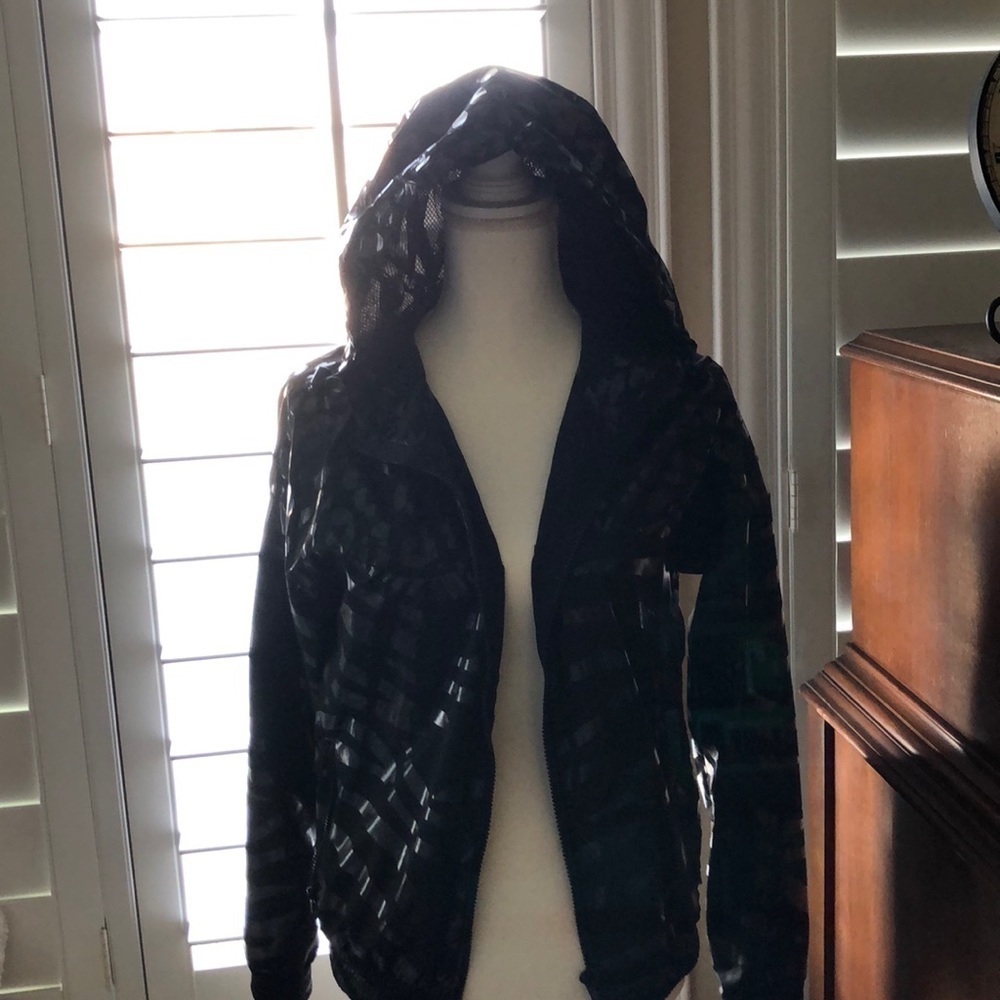 black and shiny wind breaker jacket